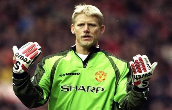 Man United Goalkeeper, Peter Schmeichel showing his gloves